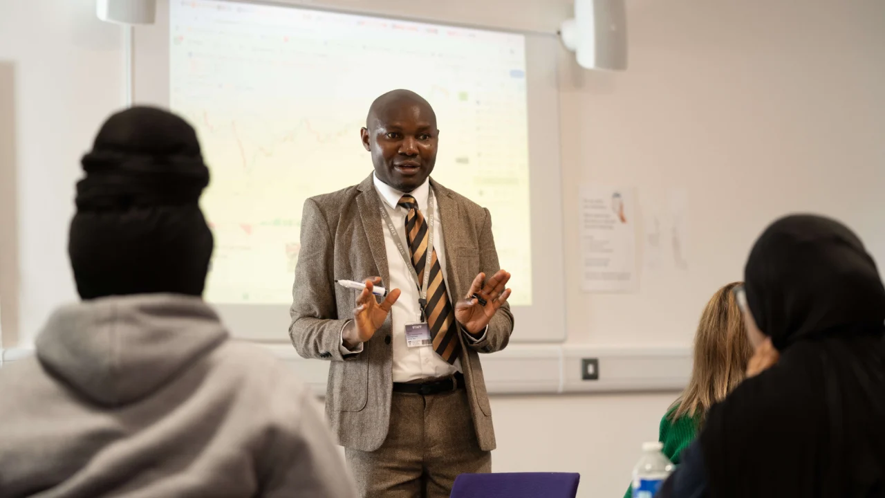 Accounting and Finance students with tutor in lecture