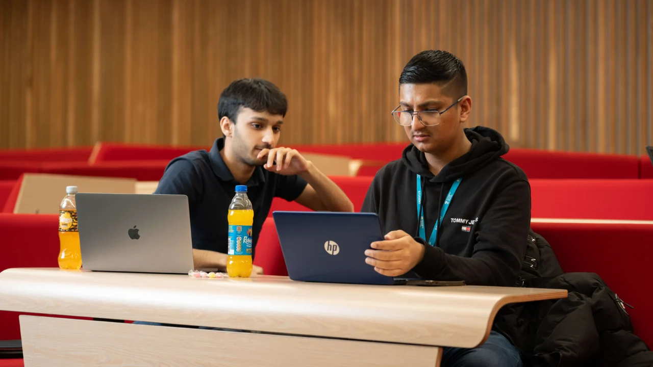 Two Applied Arts and Humanities students in lecture room