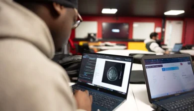 Computer Science student in class on laptop