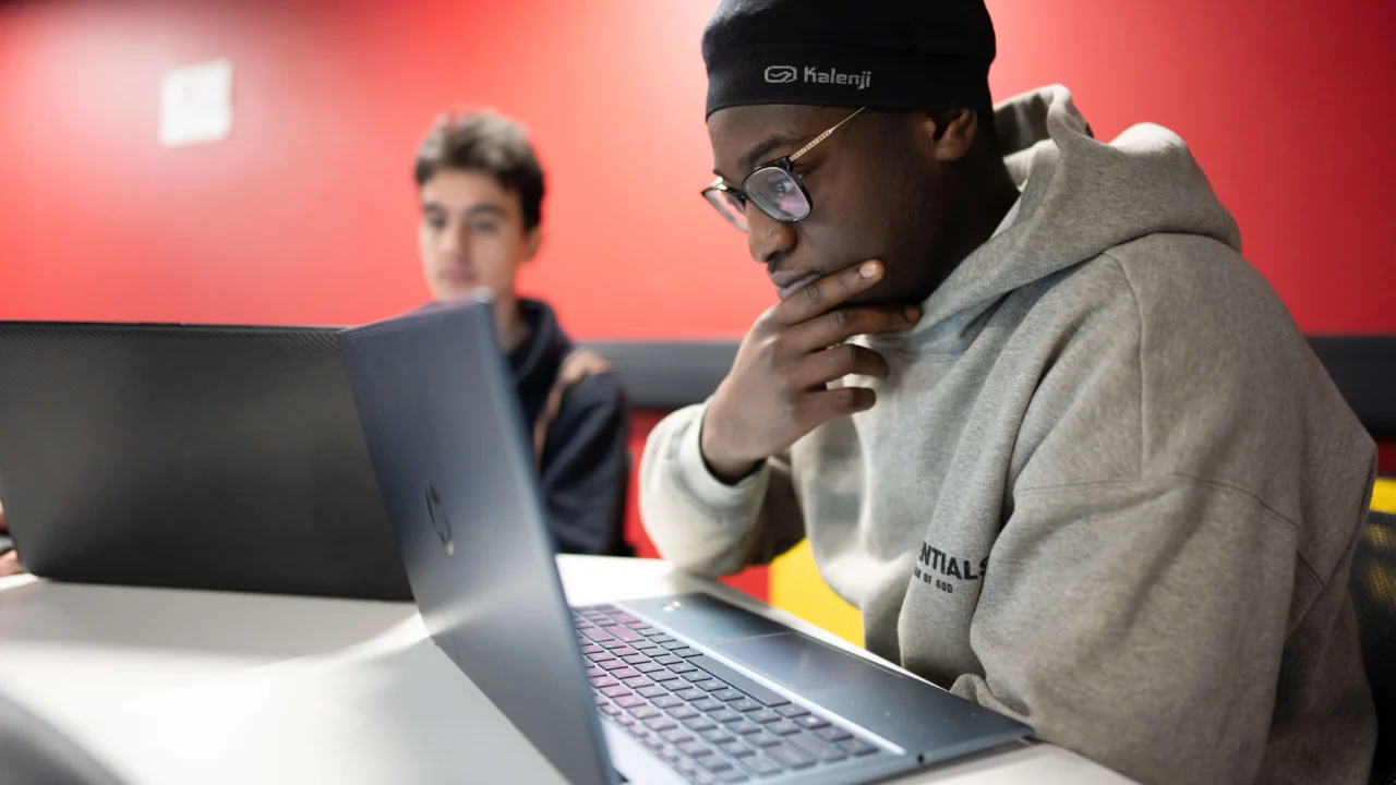 Computer Science student in class on laptop