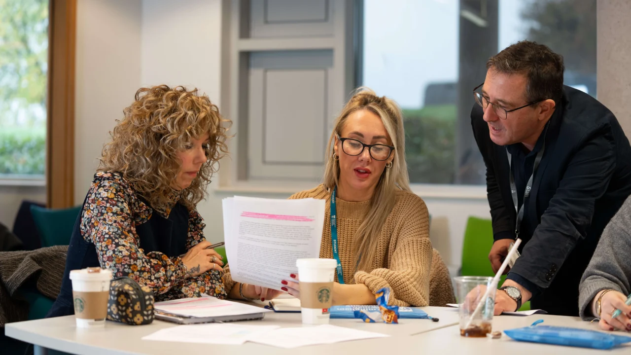 Counselling studies student in classroom discussion with tutor