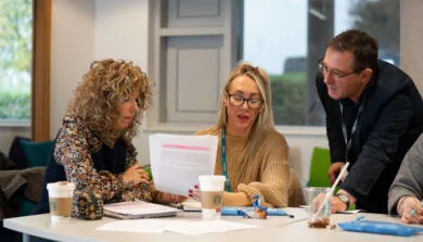 Counselling studies student in classroom discussion with tutor