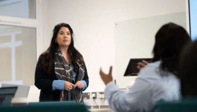 Counselling studies student in class talking to tutor