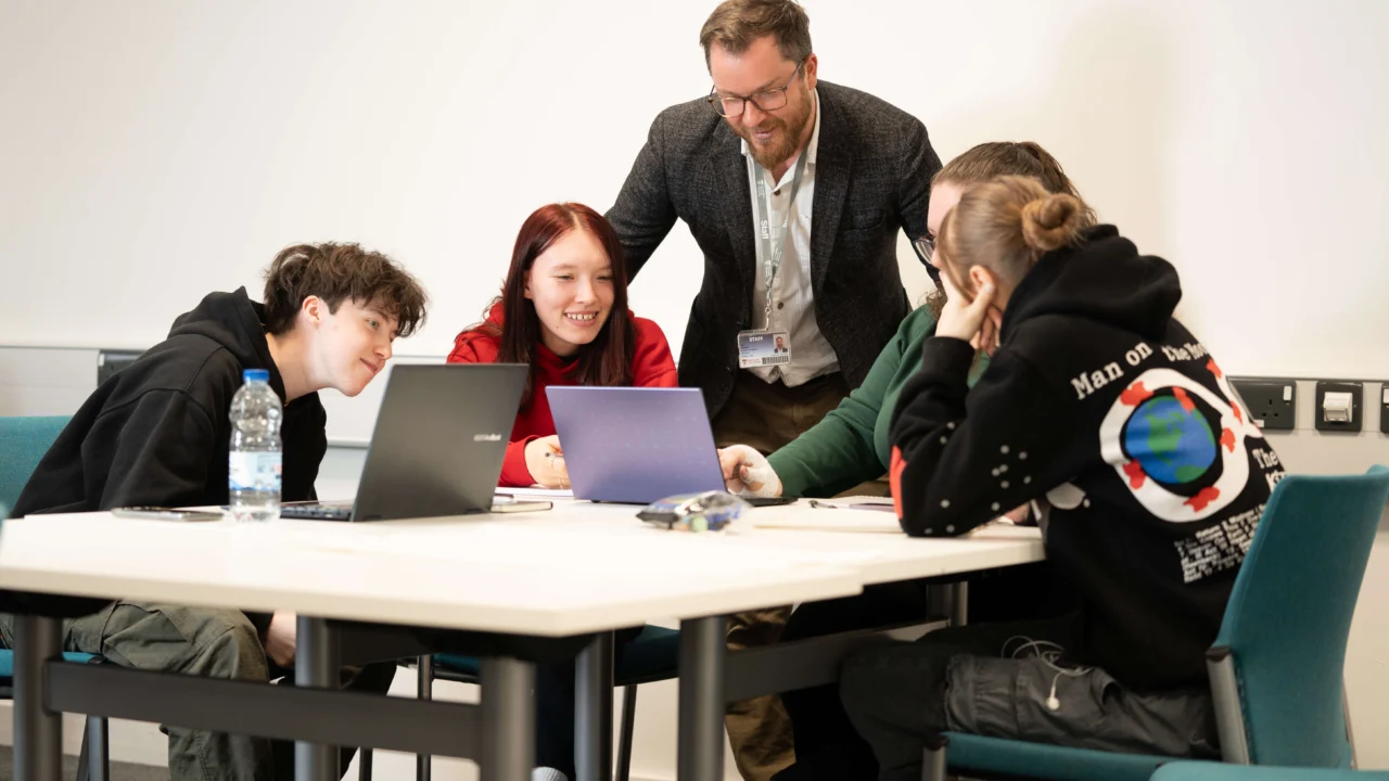 Education, Childhood and Professional Studies students in classroom with laptop