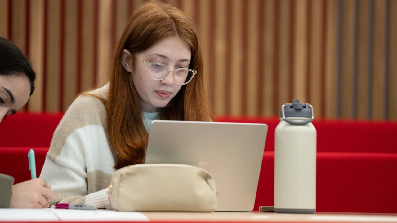 Education, Childhood and Professional Studies students in classroom with laptop
