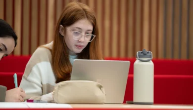 Education, Childhood and Professional Studies students in classroom with laptop