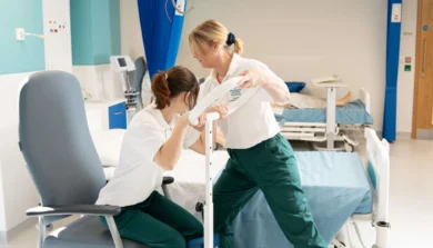 Physiotherapy helping someone out of a chair