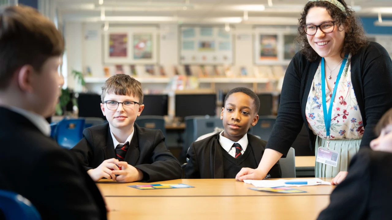 Secondary Education teacher in classroom with students