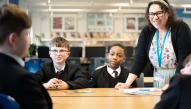 Secondary Education teacher in classroom with students