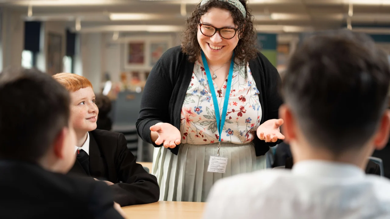 Secondary Education teacher in classroom with students