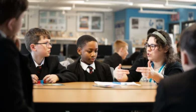 Secondary Education teacher in classroom with students