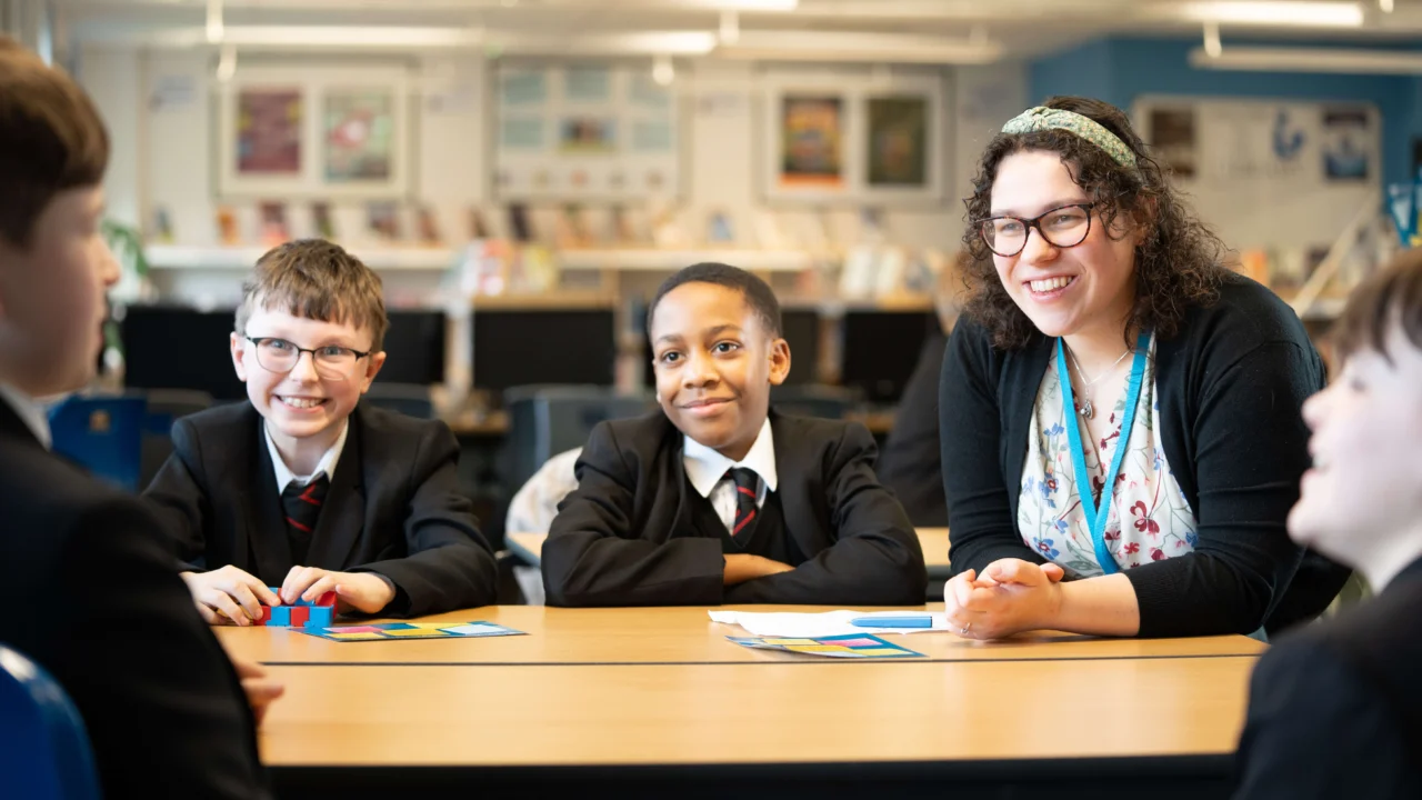 Secondary Education teacher in classroom with students