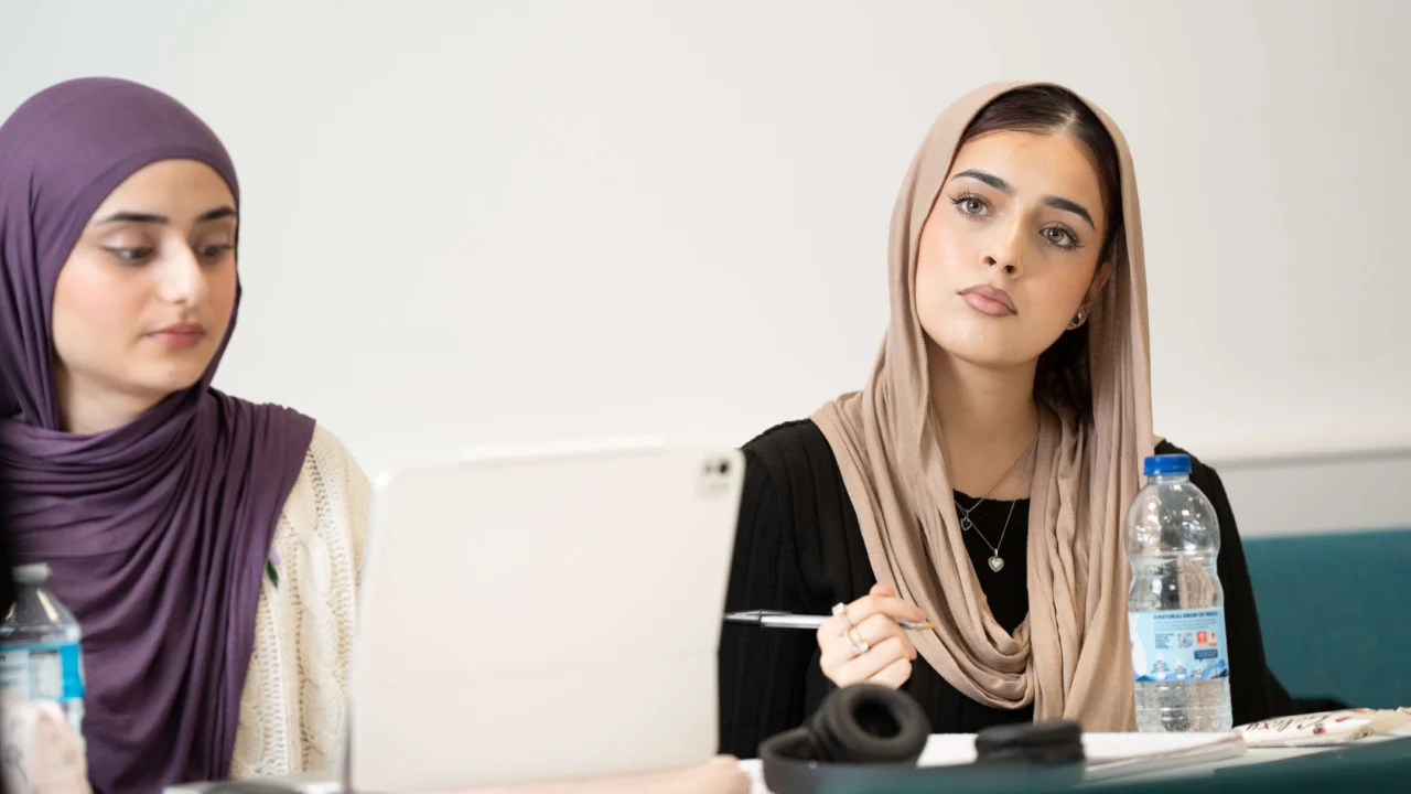 Secondary students engaged in a classroom activity at Birmingham Newman University.