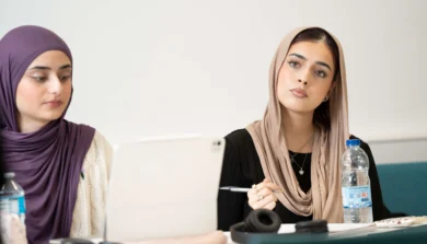 Secondary students engaged in a classroom activity at Birmingham Newman University.