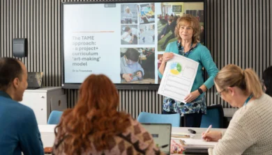 Teacher leading a lesson with students in a classroom.