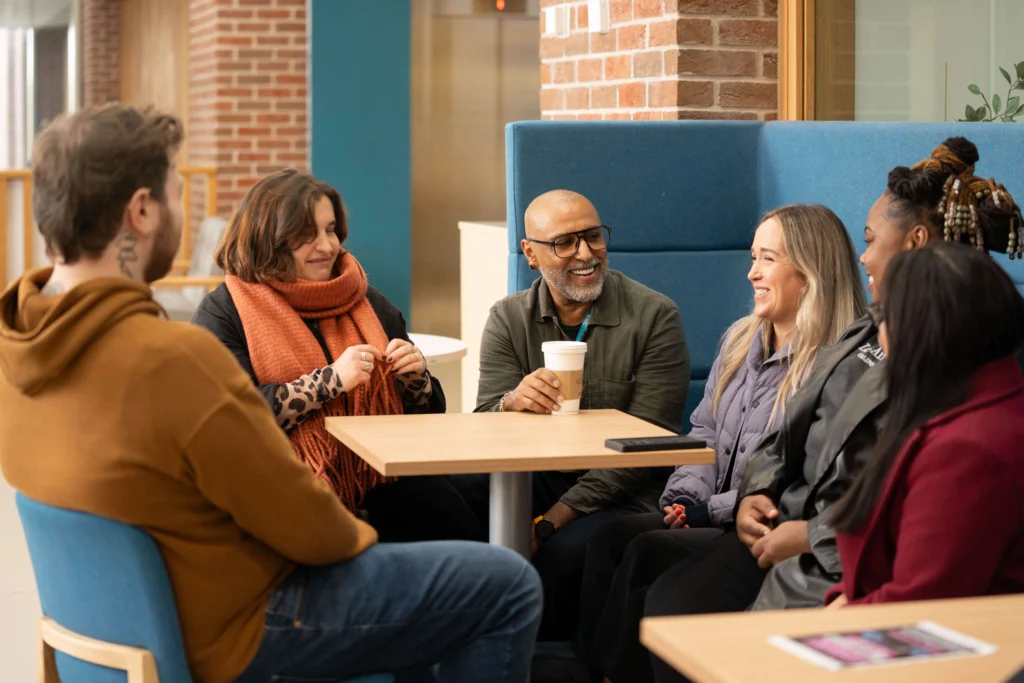 Group of students talking together in a social environment.