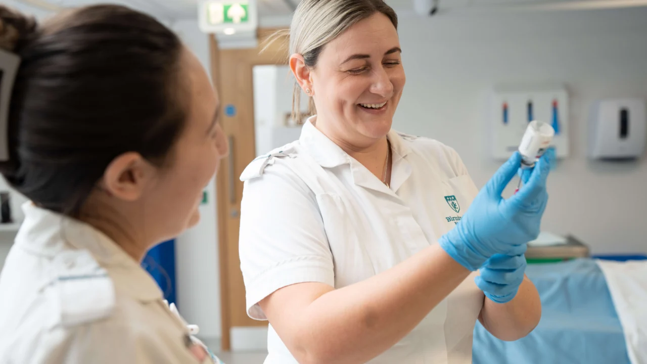 Mental Health Nurses on a ward measuring medicine