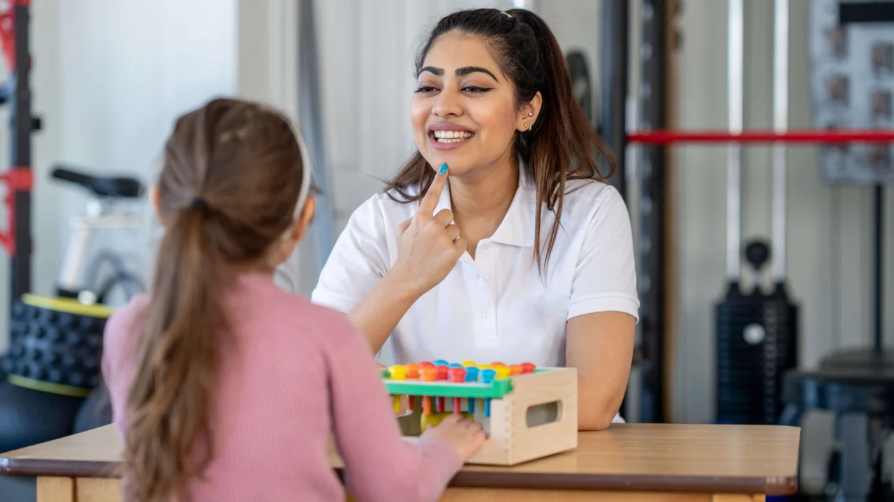 Speech and Language Therapist in a session with a young child