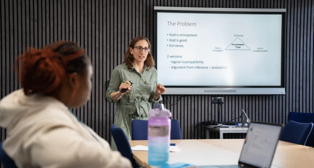 Lecturer during an Applied Humanities lesson talking to students
