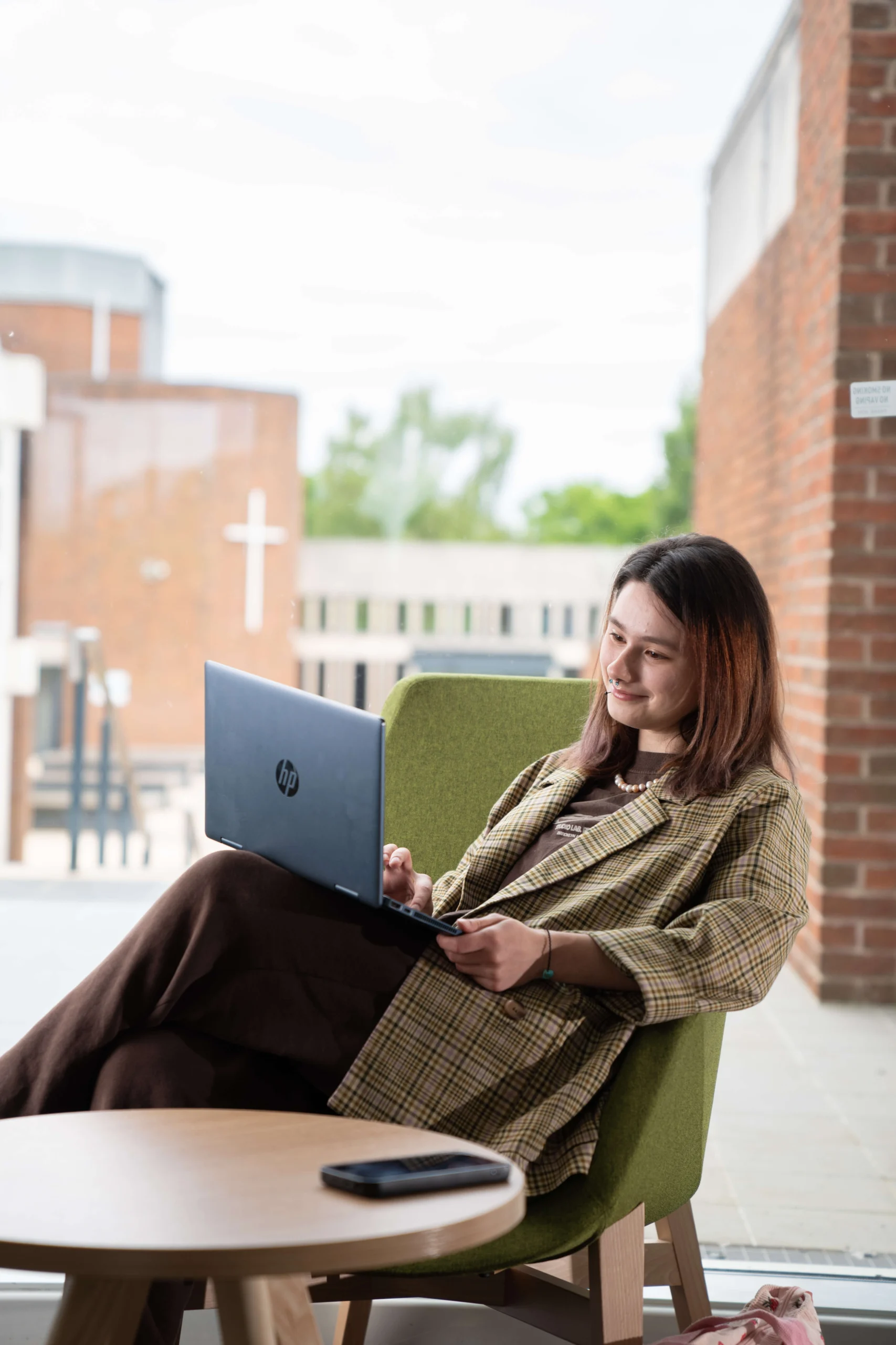 Student sitting down with laptop