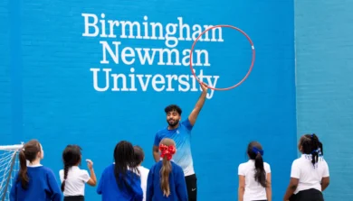 Student with hula hoop and young children