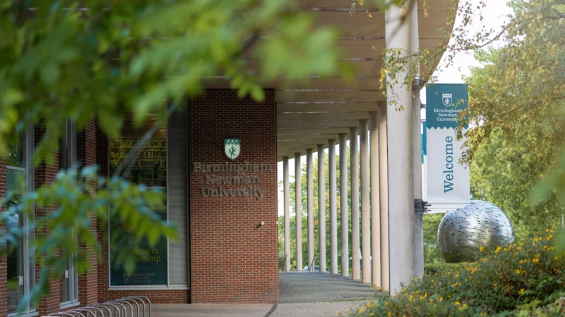 Exterior of Birmingham Newman with globe