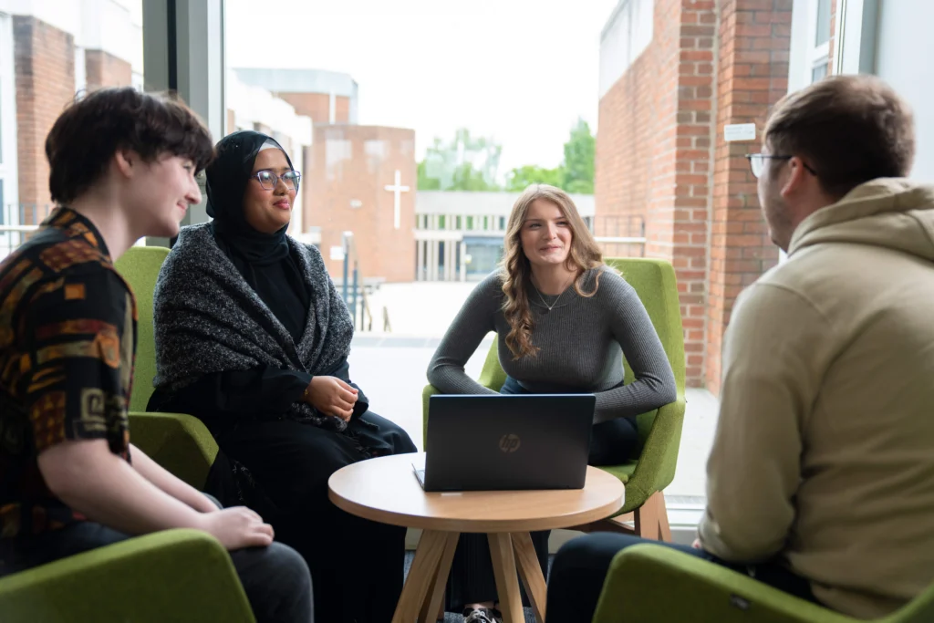 Students sitting around table talking