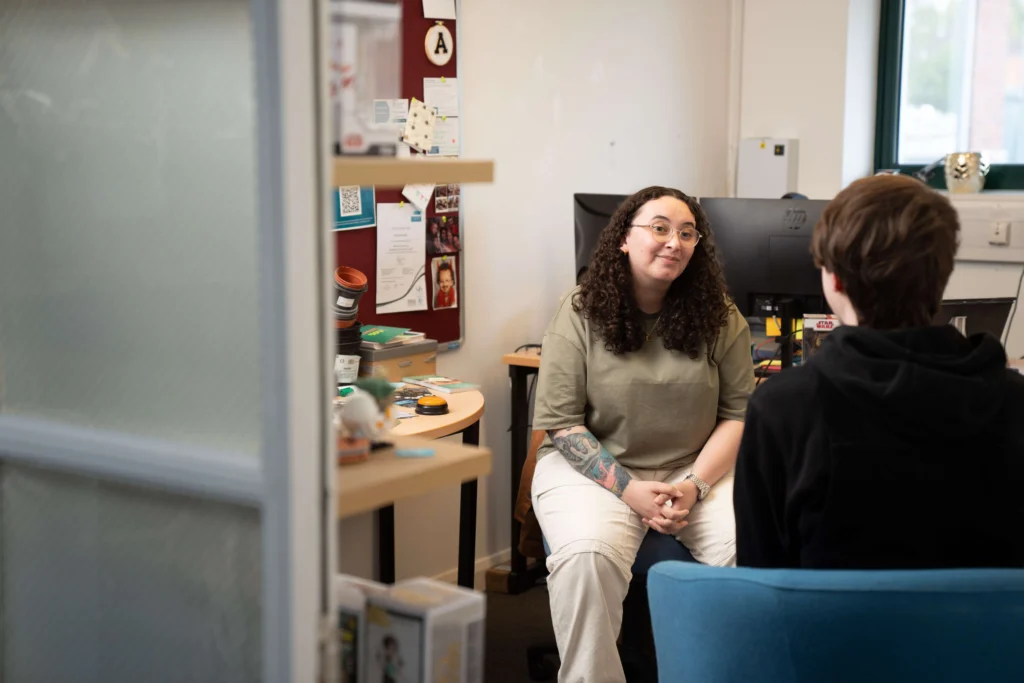 Staff member talking to a student in Student Support