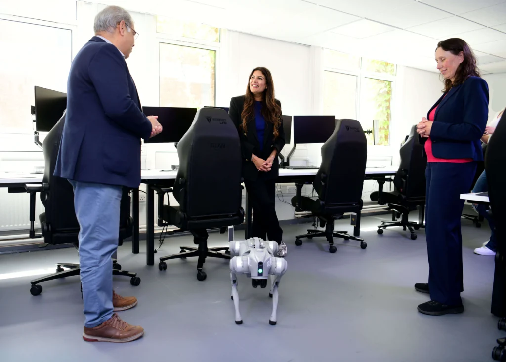 Preet Gill MP talking with Kate Dobson and Dr. Adnan Qureshi in the AI Lab