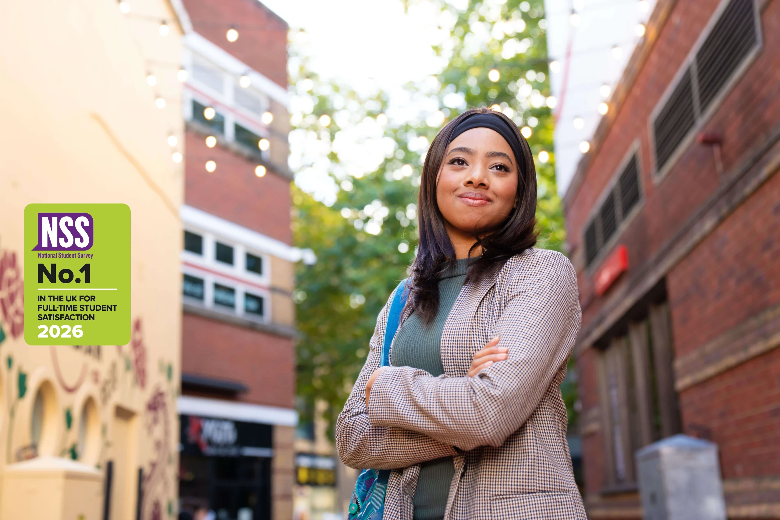 Student in Birmingham. with National Student Survey - number 1 in the UK for full-time student satisfaction 2026 logo