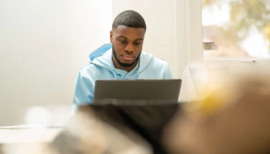 Business Management student in lecture with laptop