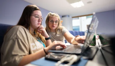 Computer Science students in class on laptop