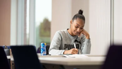 Business student in class working