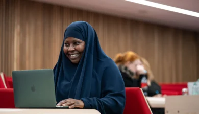 Education, Childhood and Professional Studies in lecture theatre with laptop
