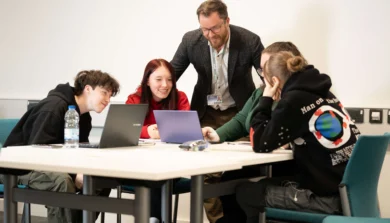Education, Childhood and Professional Studies students in classroom with laptop