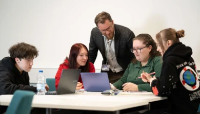 Education, Childhood and Professional Studies students in classroom with laptop