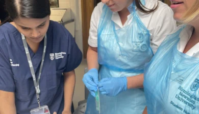 trainee nurses taught how to use equipment