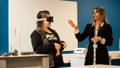 Psychology students with tutor doing a practical with goggles