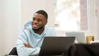 Student sitting in front of laptop in class